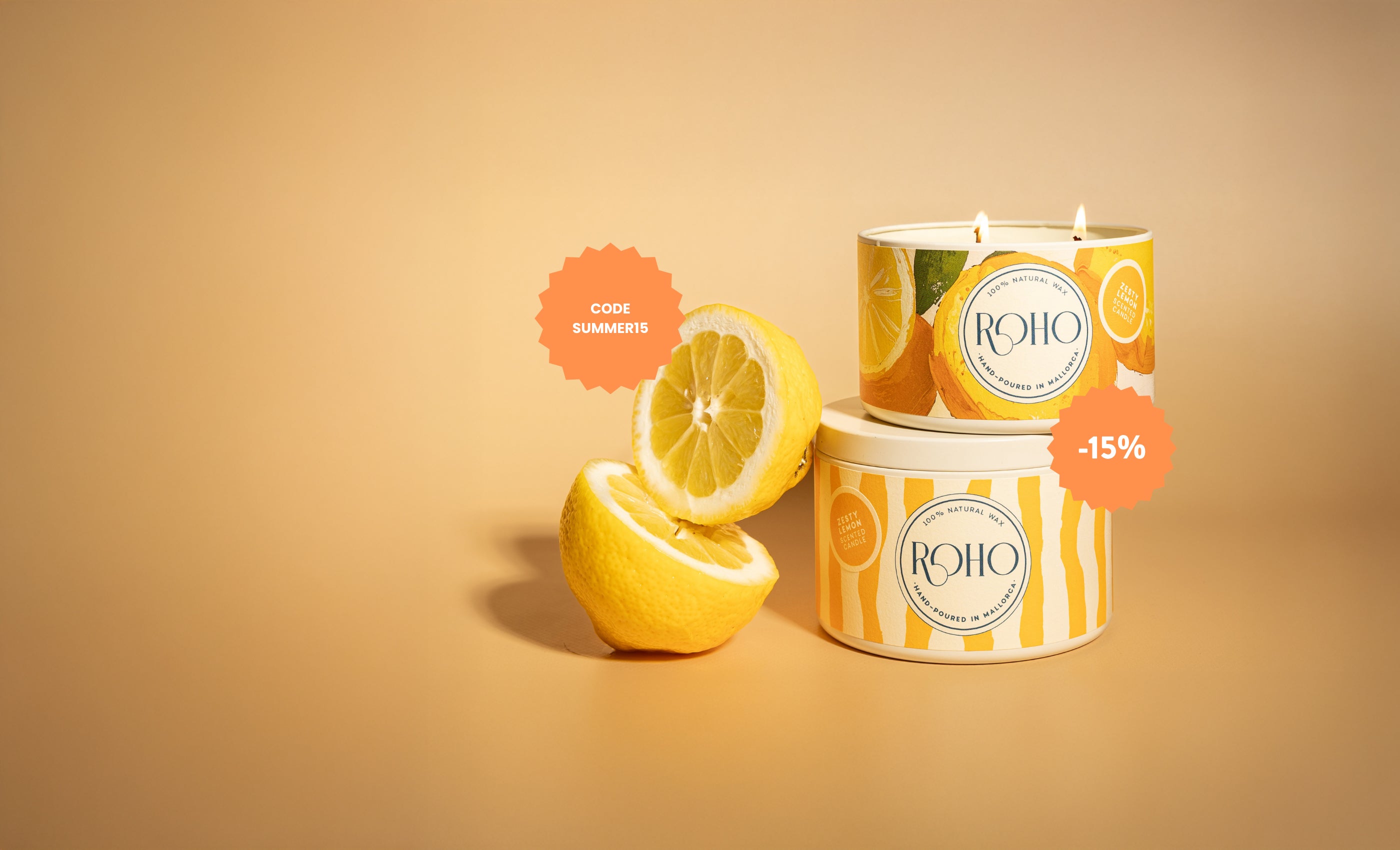 Candles with lemon design and 'ROHO' branding on a beige background